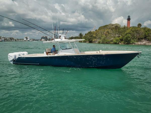 Valhalla Boatworks V-41 2023 Valhalla Boatworks V-41 in blue on the water with fishing rods.