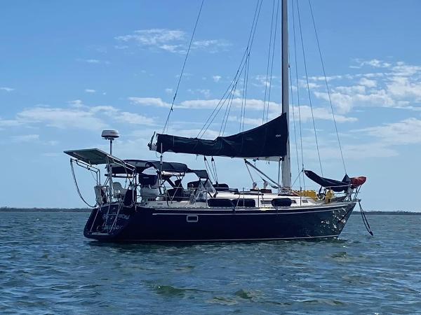 Freedom F-38 Sailboat Freedom F-38, 1991 model, anchored on calm water under a clear sky.