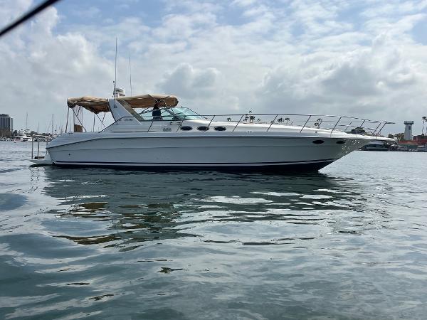 Sea Ray 400 Express Cruiser 1994 Sea Ray 400 Express yacht on calm water under a cloudy sky.