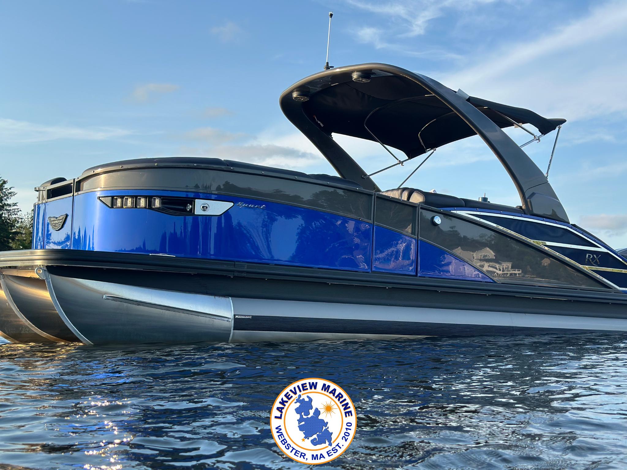 Bennington RX 23 RXSBA 2024 Bennington RX 23 RXSBA pontoon boat on water, featuring sleek blue and black design.