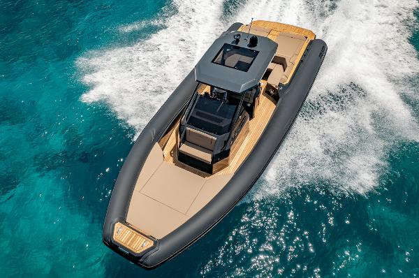 Renier R12 EFB 2024 Renier R12 EFB boat cruising on clear blue water.