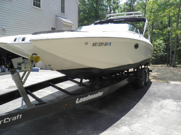MasterCraft 280 SST 2006 MasterCraft 280 SST boat on Loadmaster trailer in driveway.