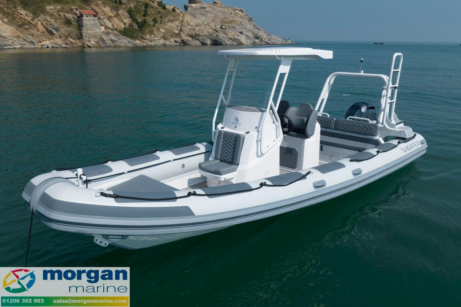 Highfield Patrol 700 2025 Highfield Patrol 700 boat on calm water near rocky coastline, displayed by Morgan Marine.