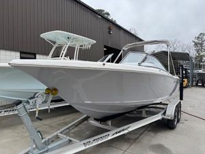 Key West 203 DFS 2025 Key West 203 DFS boat on trailer, parked outside a building.