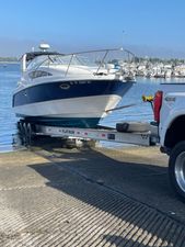 Bayliner 285 express cruiser 2004 Bayliner 285 Express Cruiser on trailer, ready for launch at marina.