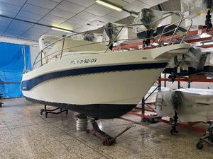 Faeton 630C 2003 Faeton 630C boat in indoor storage, elevated on supports.