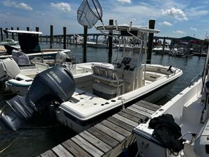 Carolina Skiff 21 Ultra Elite 2015 Carolina Skiff 21 Ultra Elite boat docked with Yamaha outboard motor.