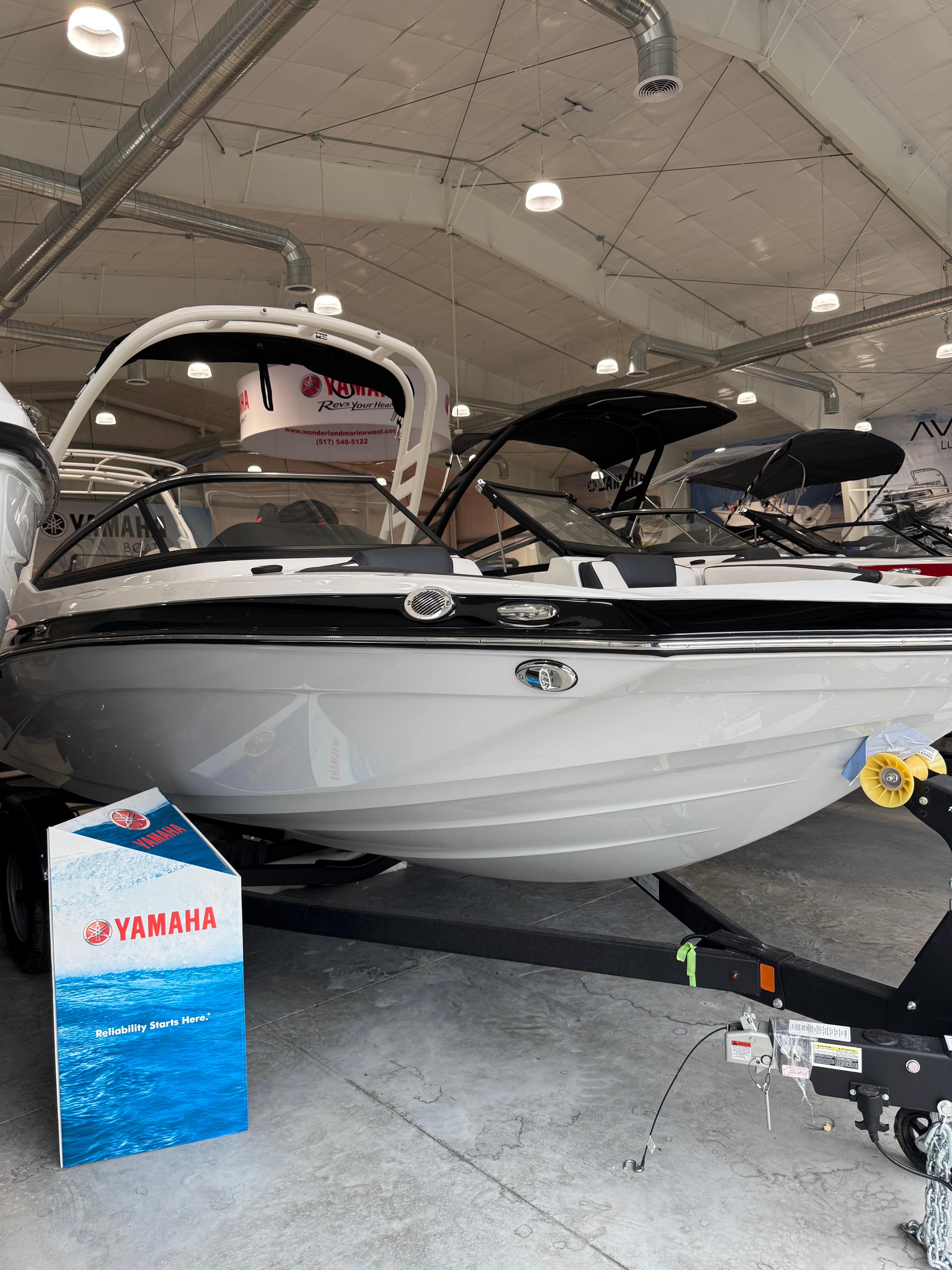 Yamaha Boats 195S 2025 Yamaha Boats 195S displayed in a showroom, highlighting sleek design and modern features.