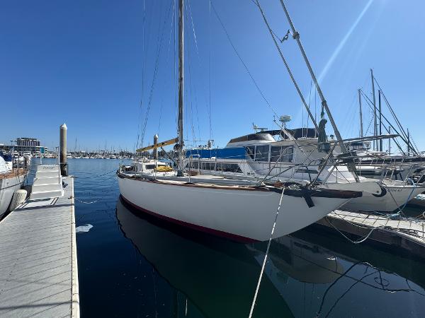 Columbia Yacht 50 1967 Columbia Yacht 50 docked at marina under clear blue sky.