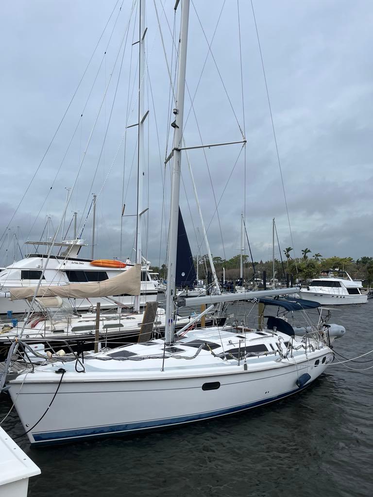 Hunter 380 Sailboat Hunter 380, 2000 model, docked at marina with overcast sky.