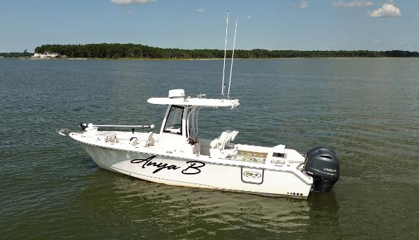 Sea Hunt Gamefish 25 2018 Sea Hunt Gamefish 25 boat on calm water, side view.