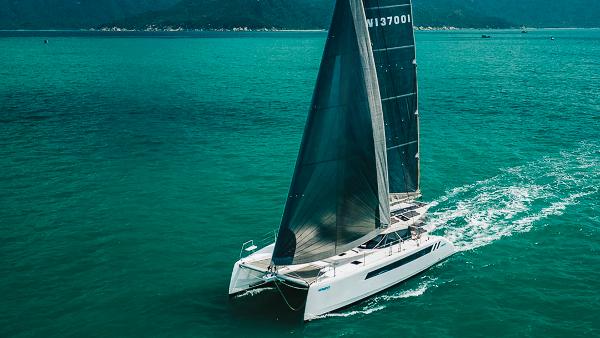 Seawind 1370 2025 Seawind 1370 catamaran sailing on turquoise waters.
