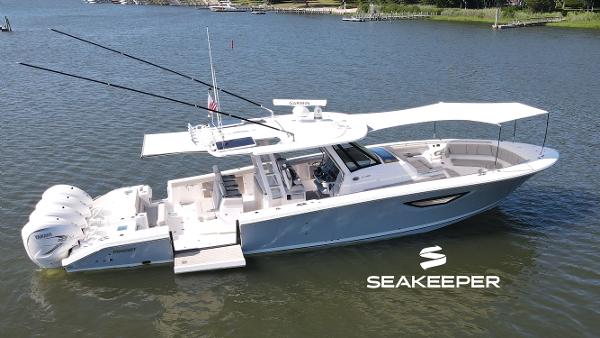 Pursuit S 428 Sport 2024 Pursuit S 428 Sport boat on water, featuring Seakeeper stabilization technology.