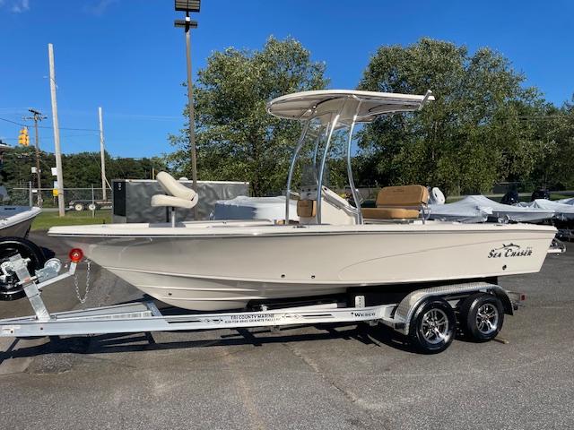 Sea Chaser LX 2024 Sea Chaser LX boat on trailer, parked outdoors under clear blue sky.
