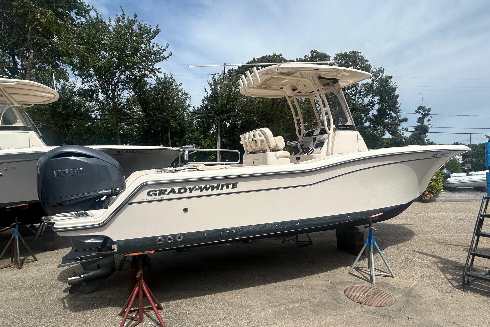 Grady-White Fisherman 236 2023 Grady-White Fisherman boat on stands, featuring Yamaha outboard motor.