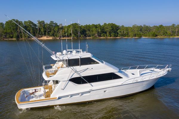 Hatteras 70 Convertible 2003 Hatteras 70 Convertible yacht on calm water.