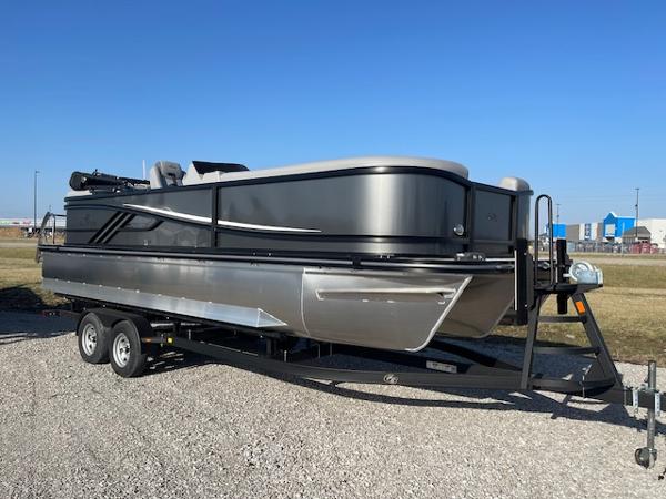 SunCatcher Fusion 324RC 2025 SunCatcher Fusion 324RC pontoon boat on trailer, parked outdoors.