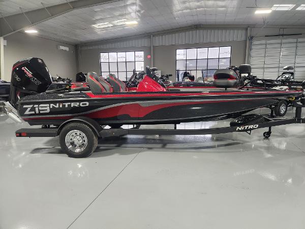 Nitro Z19 2025 Nitro Z19 boat in showroom, featuring sleek black and red design.