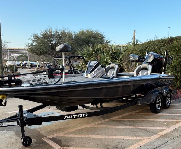 Nitro Z21 XL 2025 Nitro Z21 XL boat on trailer, parked outdoors, showcasing sleek design and modern features.