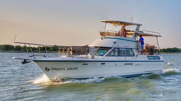 Hatteras 40 Double Cabin 1987 Hatteras 40 Double Cabin yacht cruising on a sunny day.