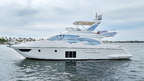 Azimut 54 Flybridge 2016 Azimut 54 Flybridge yacht on calm water, side view.