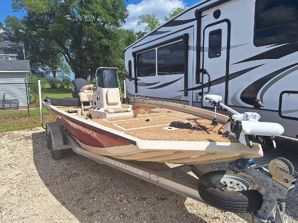 Crestliner Bay 2000 2016 Crestliner Bay 2000 boat on trailer, parked beside an RV.
