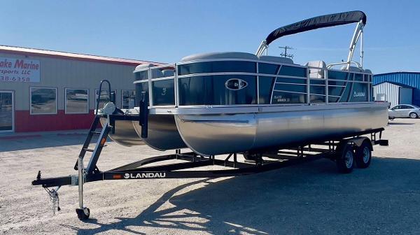 Landau Island Breeze 23 Sport Rear powered by a Suzuki 200HP 2025 Landau Island Breeze 23 Sport Rear pontoon boat on trailer.