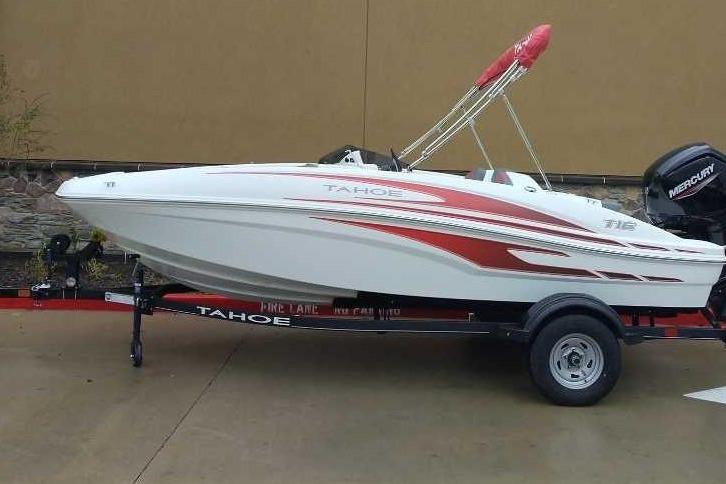 Tahoe T16 2025 Tahoe T16 boat with red accents on a trailer, parked outdoors.