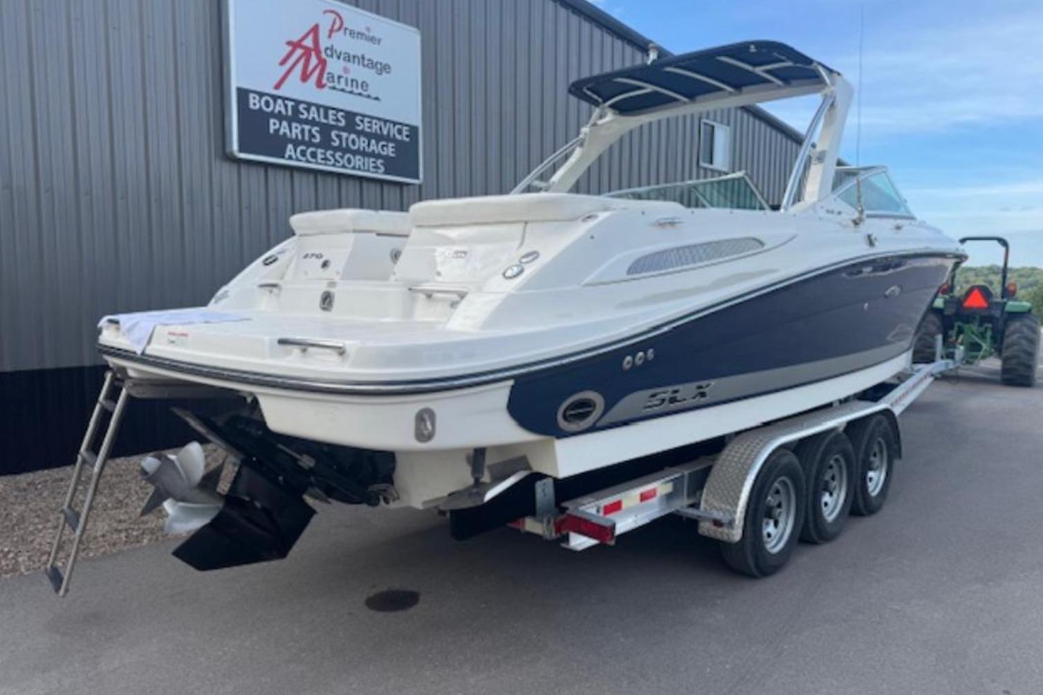 Sea Ray 270 SLX 2008 Sea Ray 270 SLX boat on trailer at marine dealership.