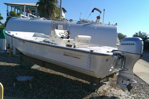 Outcast 19V 2017 Outcast 19V boat with Honda outboard motor on display.