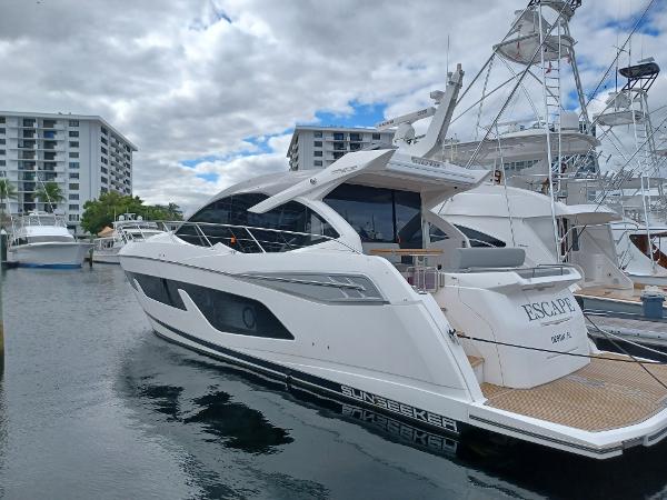 Sunseeker Predator 50 2020 Sunseeker Predator 50 yacht docked at marina under cloudy sky.