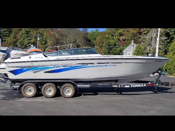 Formula 272 SR1 1991 Formula 272 SR1 boat on a trailer, side view.