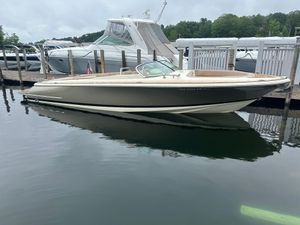 Chris-Craft Launch 30 2019 Chris-Craft Launch 30 boat docked at marina, calm water, overcast sky.