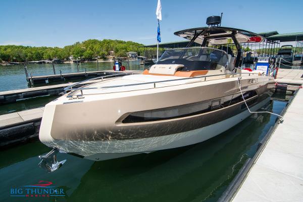 Invictus GT320S 2024 Invictus GT320S luxury yacht docked at marina.