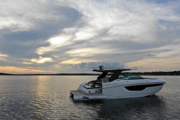 Cruisers Yachts 38 GLS 2022 Cruisers Yachts 38 GLS on serene water at sunset.