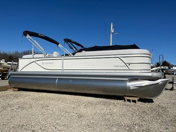 Godfrey 2286SB 2024 Godfrey 2286SB Sweetwater pontoon boat on gravel lot.