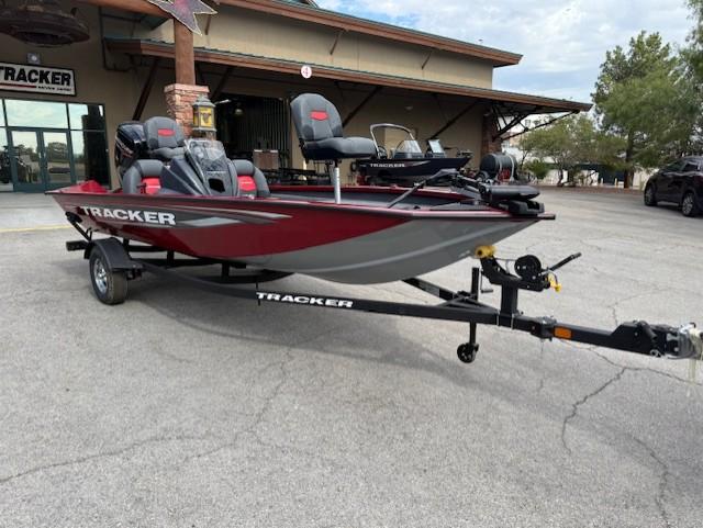 Tracker Pro Team 175 2025 Tracker Pro Team 175 boat on trailer, parked outdoors near a building.