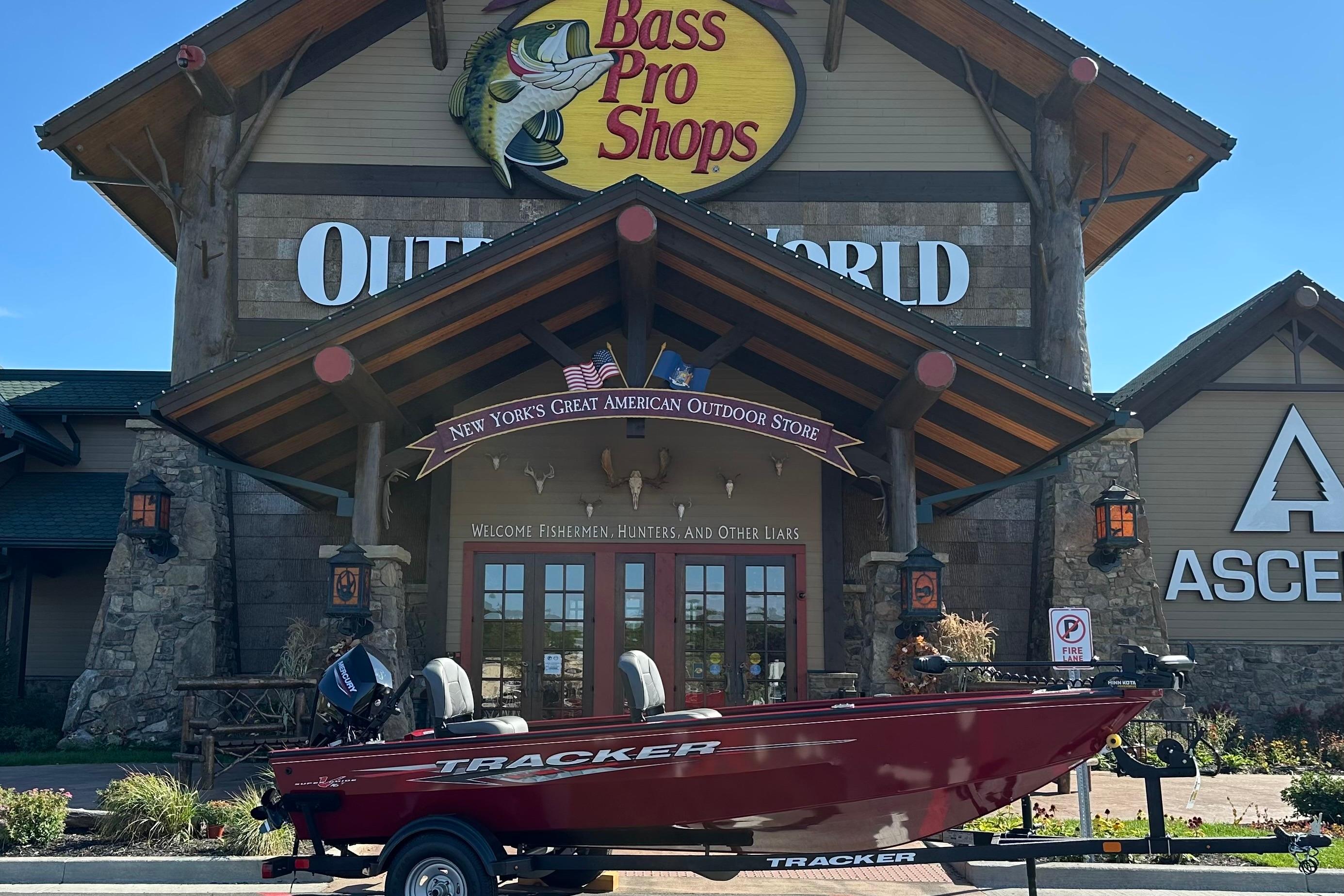 Tracker Super Guide V-16 T 2025 Tracker Super Guide V-16 T boat outside Bass Pro Shops store.