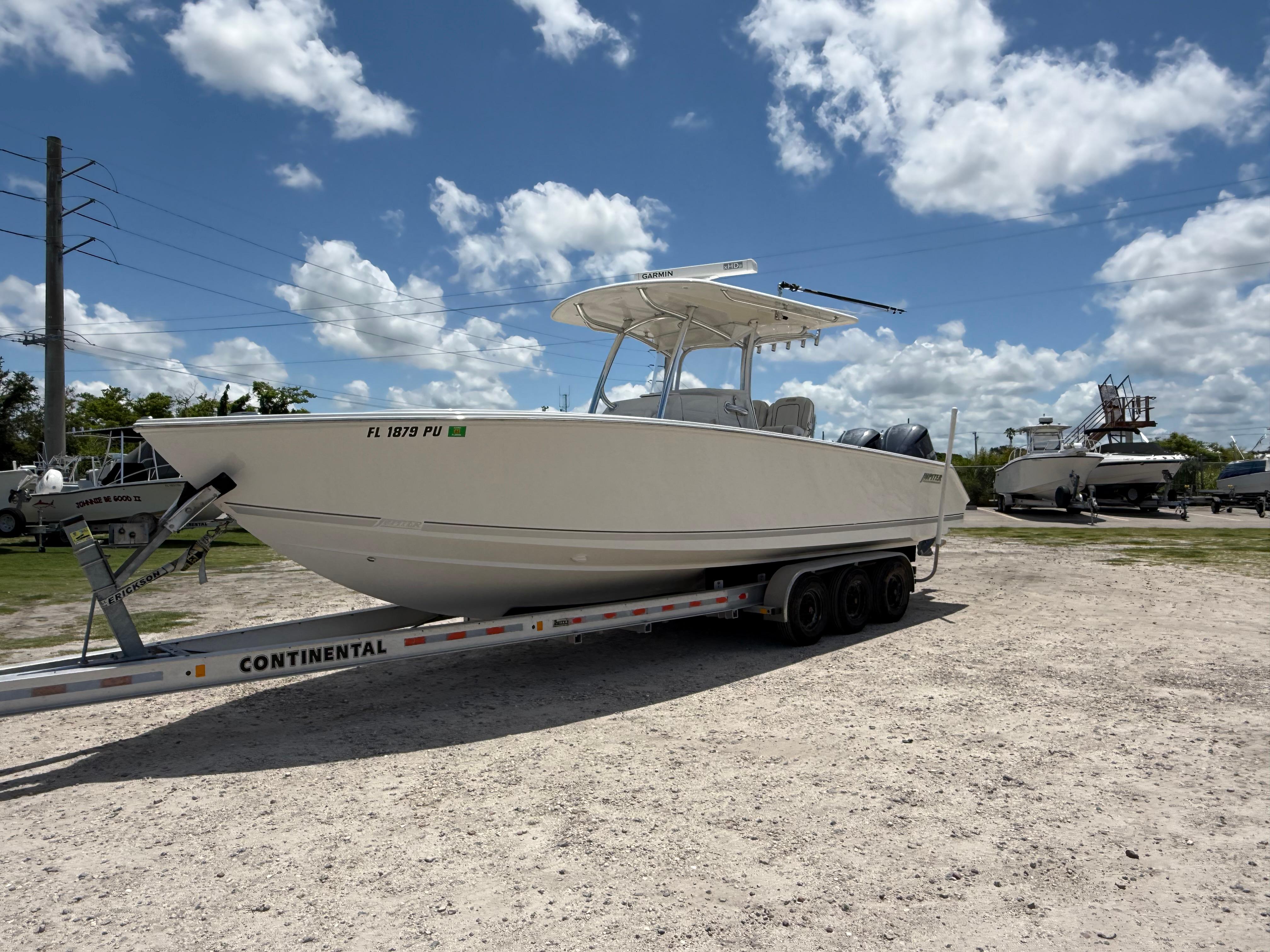 Jupiter 30 FS 2014 Jupiter 30 FS boat on trailer under cloudy sky.