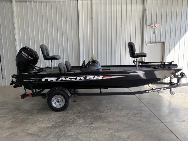 Tracker Pro 170 2025 Tracker Pro 170 fishing boat in a showroom, side view.