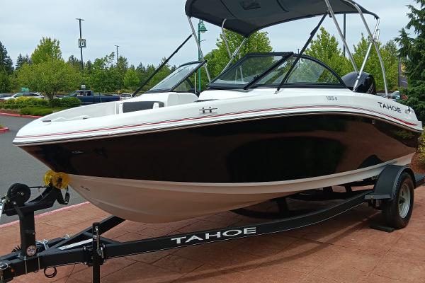 Tahoe 185 S 2024 Tahoe 185 S boat on a trailer in a parking lot.