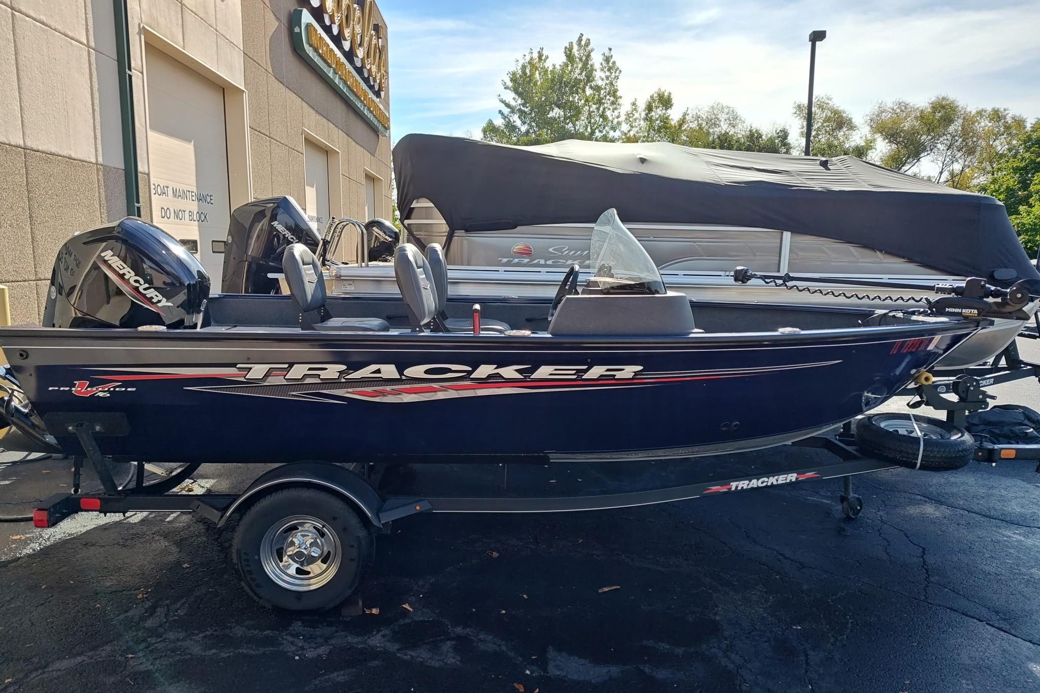Tracker Pro Guide V-16 SC 2023 Tracker Pro Guide V-16 SC boat on trailer, parked outdoors.