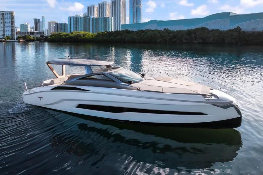 Tecnomar evo 55 Luxury Tecnomar Evo 55 yacht cruising near city skyline, 2017 model.