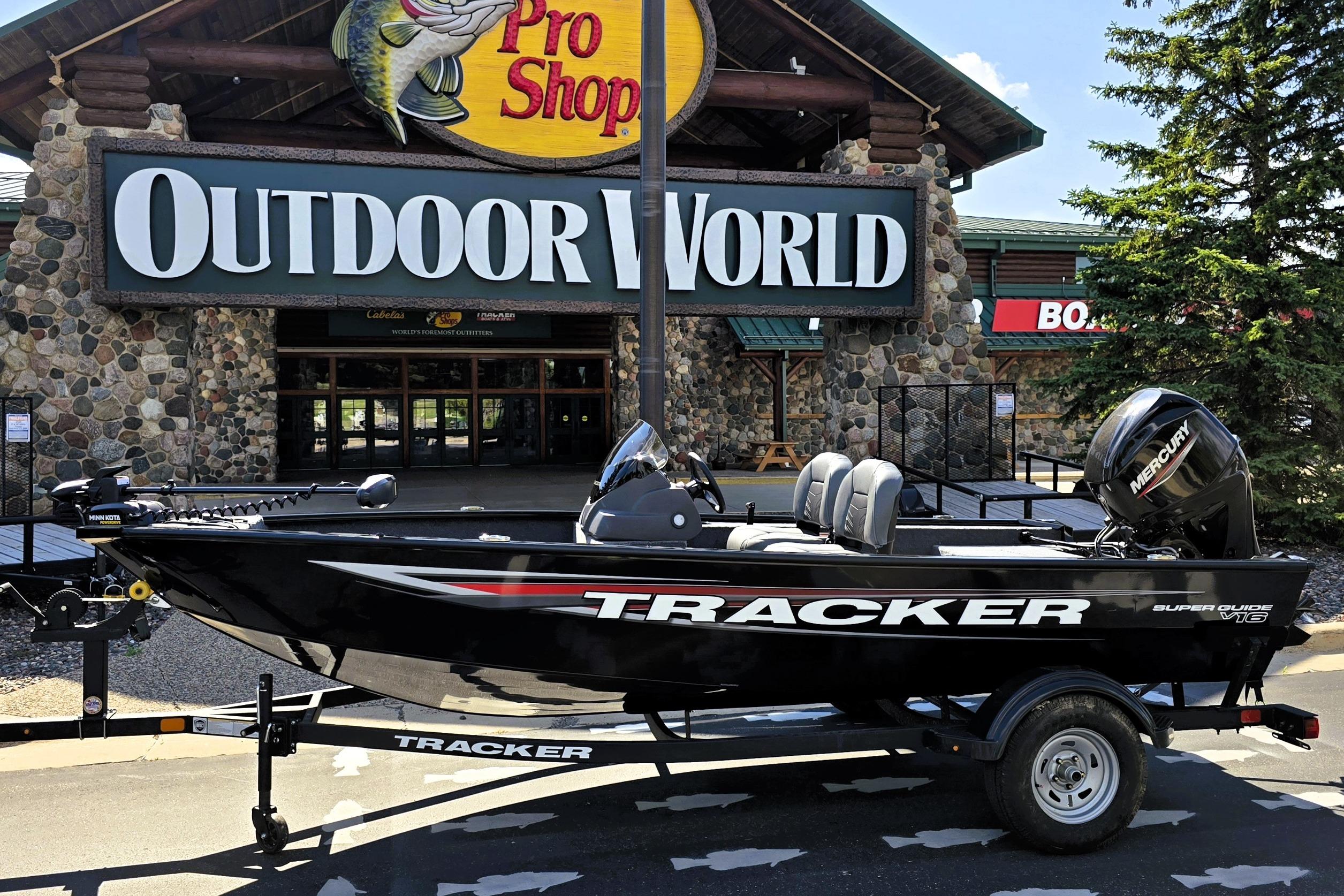 Tracker Super Guide V-16 SC 2026 Tracker Super Guide V-16 SC boat displayed outside Outdoor World store.
