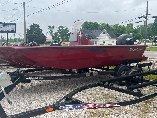 SeaArk 872 RX 2024 SeaArk 872 RX boat in red on a trailer, parked outdoors.