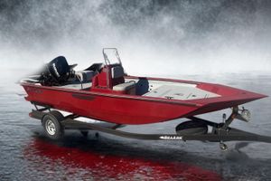 SeaArk 872 RX 2024 SeaArk 872 RX boat on trailer, red exterior, Suzuki engine, misty water background.