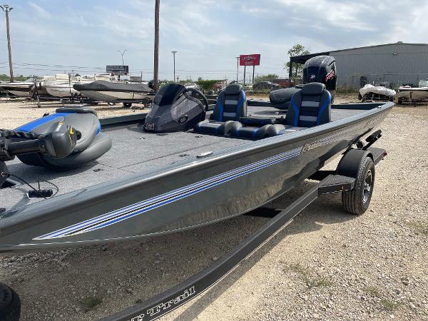 Ranger RT188P 2025 Ranger RT188P fishing boat with dual seats and motor, parked on a trailer.