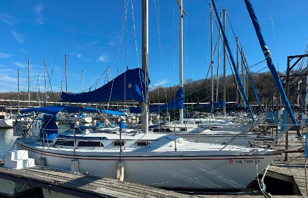 Catalina 30 1988 Catalina 30 sailboat docked at marina under clear blue sky.