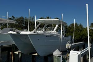 World Cat 255 DC 2022 World Cat 255 DC boat docked, featuring sleek design and dual hulls.