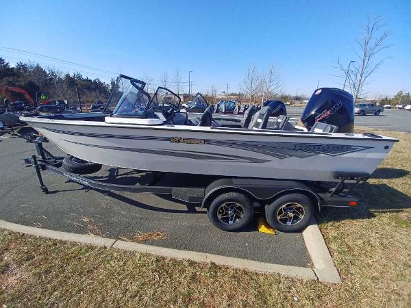 Ranger VX1988 WT 2024 Ranger VX1988 WT fishing boat on trailer in parking lot.